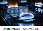 Small photo of Gas burners and US dollar bill, USA money on home gas stove, blue propane flame and currency. Concept of World economy, energy crisis, oil, Russian natural gas cost, embargo and sanctions to Russia.