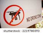 Close up shot of a no drone zone sign. 