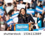 Small photo of New York, NY - October 19, 2019: U.S. Representative Alexandria Ocasio-Cortez speaks during Bernie Sanders Rally "Bernie's Back" in Queensbridge Park. She endoreses him for President of USA