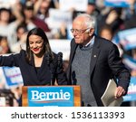 Small photo of New York, NY - October 19, 2019: U.S. Representative Alexandria Ocasio-Cortez & U.S. Senator Bernie Sanders on stage at Bernie Sanders Rally "Bernie's Back" in Queensbridge Park