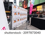 Small photo of New York, NY - December 28, 2021: Papers with messages of bad memories of 2021 to burn in the incinerator set in Latin America tradition in the middle of Times Square seen during Good Riddance Day