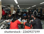 Small photo of Asylum seekers are having hot meals as Mayor Eric Adams helps distribute donated food and clothing to their families at public school 20 in New York on February 11, 2023
