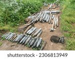 Small photo of Unexploded munition collected by de-mining unit of National Guards of Ukraine before they will be destroyed seen in near Kherson in Ukraine on May 22, 2023