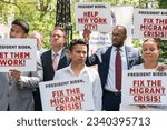 Small photo of Rally calling upon President Joe Biden to declare a state of emergency on migrant crisis in NYC held in City Hall Park in New York on July 31, 2023