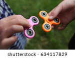 Two fidget spinners