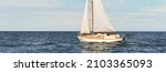 Small photo of Old expensive vintage wooden sailboat (yawl) close-up, sailing in an open sea. Coast of Maine, US. Sport, cruise, recreation, leisure activity