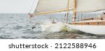 Small photo of Old expensive vintage two-masted sailboat (yawl) close-up, sailing in an open sea during the storm. Sport, cruise, tourism, recreation, transportation, nautical vessel. Panoramic view, seascape