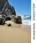 Ocean waves and picturesque rocks and on Divorce beach - a small beach on the bay side in Cabo San Lucas, other side of Lover`