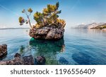 Small photo of Fabulou morning view of famous Brela stone. Picturesque summer seascape of Adriatic sea, Dalmatian coast, Croatia, Europe. Beautiful world of Mediterranean countries.