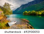 Impressive summer view of Lovatnet lake, municipality of Stryn, Sogn og Fjordane county, Norway. Colorful morning scene in Norway. Beauty of nature concept background.