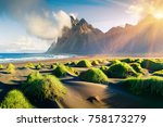Impressive summer view of green dunes on the Stokksnes headland with Vestrahorn mountain on background, southeastern Iceland, Europe. Beauty of nature concept background.