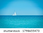 White Yacht On Blue Sea With...