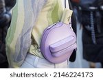 Small photo of MILAN, ITALY - FEBRUARY 23, 2022: Man with Fendi purple table tennis bat case