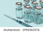 closeup of vaccine bottles and... | Shutterstock . vector #1996562576