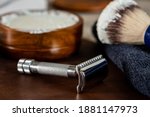 Old style men’s shaving accessories, safety and straight razors, brush and shaving soap, for home use.