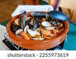 Small photo of Traditional Spanish seafood zarzuela - stewed fish fillets, sea molluscs and crustaceans in thick sauce