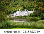 Small photo of Kylemore Abbey with water reflections in Connemara, County Galway, Ireland, Europe. Benedictine monastery founded 1920 on the grounds of Kylemore Castle. Mainistir na Coille Moire.
