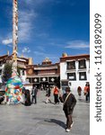Small photo of Lhasa. Tibet. 10.03.06. The Barkhor is a circuit of streets in Lhasa that surround the Jokhang Buddhist Temple. Pilgrims perambulate clockwise around the circuit to reach the temple.