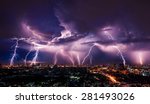Lightning storm over city in...