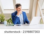 Small photo of Cropped shot of careworn businessman sitting at desk behind his laptop and looking thoughtfully while working in the office.