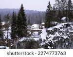 Snowy mountain park Ruskeala in the Republic of Karelia, Russia in winter. marble quarry and bridge