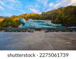 Small photo of Fukuoka, Japan - Nov 21 2022: Nanzoin Temple in Fukuoka is home to a huge statue of the Reclining Buddha (Nehanzo) which claims to be the largest bronze statue in the world.