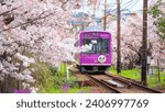 Small photo of Kyoto, Japan - March 31 2023: Keifuku Tram is operated by Keifuku Electric Railroad. It consists of two tram lines and it's one of the best cherry blossom spots in the west of Kyoto city