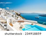White architecture on Santorini island, Greece. Swimming pool in luxury hotel. Beautiful view on the sea