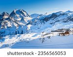Ski resort in winter Alps mountains, France. View of ski slopes and ski lift. Meribel, France. Winter landscape