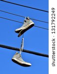 An Old All Star Shoes Hanged On ...