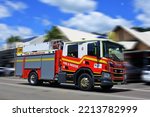 Small photo of AIRLIE BEAH, QLD - OCT 02 2022:Australian firetruck rushing to scene.The global fire trucks market size was estimated at USD 4.30 billion in 2015.