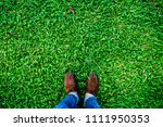 man stand on grass field