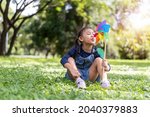 happy asian little girl playing ... | Shutterstock . vector #2040379883