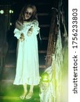 Small photo of Little girl ghost in a nightgown wanders through the old house at night. Halloween.