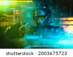 A cyberpunk warrior of the future controls a digital hologram. Game, virtual reality. Future technologies.