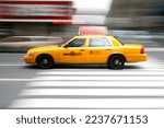 Motion blur of yellow taxi in New York City.