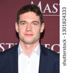 Small photo of LOS ANGELES - FEB 01: Tom Brittney arrives for the PBS Masterpiece Photo Call on February 01, 2019 in Pasadena, CA