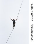 Small photo of LUBIN, POLAND - SEPTEMBER 25, 2021: VIII Memorial of Iwona Buczek in climbing on difficulty. A tightrope walker is walking on the rope at a high altitude.