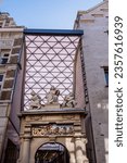 Small photo of Amsterdam, The Netherland - September 5, 2023: Rasphuis Gate, made by Hendrick de Keyser. Relief above arch depicts a chariot laden with Brazilian wood pulled by lions, bears, wild boars and tigers.