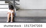 Small photo of Asian child touchy or kid girl sleeping and angry cry with sad or have problems and bend down the head lonely to wait for the parents on city street at nursery or kindergarten and pre school