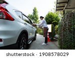 Small photo of Curbside pick up.Store worker prepare and hold foods from customer order online delivery to customer in the outside.Social distance and contactless prevent covid-19.