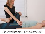 Small photo of Hip joint pain, Physiotherapy treatment to improve scoliosis pelvic tilt inclination