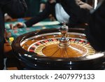 Small photo of Close-up of a spinning roulette wheel at the casino, capturing the thrill of betting.