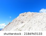 Small photo of mountain called Cima Rosetta completely of rock without vegetation in the Italian Dolomites in summer