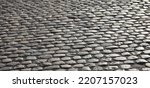 background of road pavement made with many smooth pebbles without people