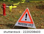 big triangle with exclamation mark and text in Italian which means CIVIL PROTECTION and a fire hydrant