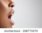 profile of a black woman with open mouth