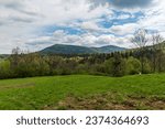 Small photo of Czantoria Mala and Velka Cantoryje hills from meadow bellow Vruzna hill in Slezske Beskydy mountains on czech - polish borders during springtime day
