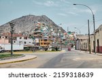 Small photo of Lima, Peru - January 02, 2022: The road leading to the hill with the slums in a disadvantaged area of the city.