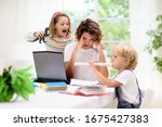 Small photo of Mother working from home with kids. Quarantine and closed school during coronavirus outbreak. Children make noise and disturb woman at work. Homeschooling and freelance job. Boy and girl playing.